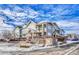 Townhouse Exterior: Two-story building with balconies and a gated entrance at 9451 Ashbury Cir # 202, Parker, CO 80134