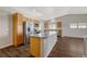 Modern kitchen with island, stainless steel appliances, and wood cabinets at 9451 Ashbury Cir # 202, Parker, CO 80134