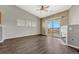 Living room features hardwood floors, fireplace, and balcony access at 9451 Ashbury Cir # 202, Parker, CO 80134