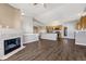 Open concept living area with kitchen, living room and fireplace at 9451 Ashbury Cir # 202, Parker, CO 80134