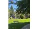 Community courtyard offers a tranquil space with a bench and well-maintained landscaping at 1850 S Pitkin Cir # B, Aurora, CO 80017