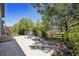 Beautiful backyard with a paved patio area and lush landscaping, perfect for outdoor entertaining at 8068 Dressage Rd, Littleton, CO 80125