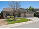 Charming home with a well-manicured lawn and a three-car garage, perfect for a growing Gathering at 8068 Dressage Rd, Littleton, CO 80125