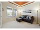 Comfortable living room with neutral carpet, abundant natural light, and a cozy seating area at 8068 Dressage Rd, Littleton, CO 80125