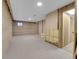 Unfinished basement featuring concrete walls and floors and a small window at 11427 Brownstone Dr, Parker, CO 80138