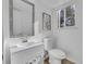 Clean bathroom with a white vanity, modern fixtures, and natural light from the window at 11427 Brownstone Dr, Parker, CO 80138