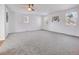 Expansive bedroom with neutral carpet, multiple windows, and ample natural light at 11427 Brownstone Dr, Parker, CO 80138