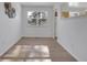 Bright dining area with hardwood floors, white walls, a modern light fixture, and a large window overlooking the yard at 11427 Brownstone Dr, Parker, CO 80138