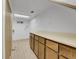 Functional laundry room featuring wooden cabinets, ample counter space, and clean, bright lighting at 11427 Brownstone Dr, Parker, CO 80138