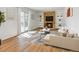 Cozy living room with a brick fireplace, built-in shelves, and sliding glass door at 11427 Brownstone Dr, Parker, CO 80138