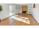 Spacious living room featuring a brick fireplace with white shelving and sliding door access at 11427 Brownstone Dr, Parker, CO 80138