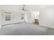 Spacious bedroom with a ceiling fan, carpet floors and two windows for natural light at 3274 S Heather Gardens Way, Aurora, CO 80014
