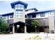 Community clubhouse featuring stonework and manicured landscaping at 3274 S Heather Gardens Way, Aurora, CO 80014