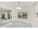 Bright dining room with sliding glass doors and view of living room at 3274 S Heather Gardens Way, Aurora, CO 80014