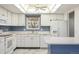 Charming kitchen with bright white appliances and cabinetry at 3274 S Heather Gardens Way, Aurora, CO 80014