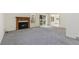 Spacious living room with fireplace, and large windows at 3274 S Heather Gardens Way, Aurora, CO 80014