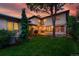 Expansive backyard with lush lawn, mature trees, and a patio, ideal for outdoor gatherings and relaxation at 1351 S Milwaukee St, Denver, CO 80210