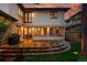 Spacious backyard with a stone patio and well-manicured lawn, perfect for outdoor entertaining and relaxing at 1351 S Milwaukee St, Denver, CO 80210