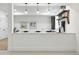 Modern basement bar featuring a white countertop, pendant lighting, and stylish decor, perfect for entertaining guests at 1351 S Milwaukee St, Denver, CO 80210
