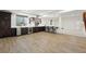 A spacious basement featuring a bar with a wine fridge and wood flooring at 1351 S Milwaukee St, Denver, CO 80210