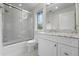 Beautiful bathroom with white tiles, glass shower, and marble countertop at 1351 S Milwaukee St, Denver, CO 80210