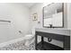 Modern bathroom with a floating vanity, stylish fixtures, and mosaic floors, offering a spa-like experience at 1351 S Milwaukee St, Denver, CO 80210