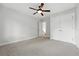 A bedroom with a ceiling fan, light gray walls, and white trim at 1351 S Milwaukee St, Denver, CO 80210