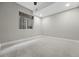 A minimalist bedroom with neutral tones and a window, providing a serene and comfortable living space at 1351 S Milwaukee St, Denver, CO 80210