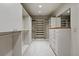 Walk-in closet with custom shelving, plenty of storage, and a full-length mirror at 1351 S Milwaukee St, Denver, CO 80210