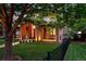 Charming stone and stucco home with a cozy front porch and lush, landscaped yard at 1351 S Milwaukee St, Denver, CO 80210