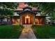 A welcoming two-story home features a stone entrance, covered porch, and well-manicured front yard at 1351 S Milwaukee St, Denver, CO 80210