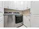 Well-equipped laundry room features modern appliances and ample storage within bright white cabinetry at 1351 S Milwaukee St, Denver, CO 80210