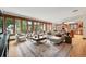 Bright and open living room features hardwood floors and a large window at 1351 S Milwaukee St, Denver, CO 80210