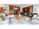 Cozy living room featuring a fireplace, custom shelving, and comfortable seating at 1351 S Milwaukee St, Denver, CO 80210
