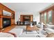 Open living room features built-ins and a large window with natural light at 1351 S Milwaukee St, Denver, CO 80210