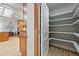 Walk-in pantry with custom shelving offering ample storage, conveniently located next to the kitchen at 1351 S Milwaukee St, Denver, CO 80210