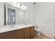 Bathroom featuring double sinks with modern fixtures and lighting at 1281 Rock Cliff Ave, Erie, CO 80516