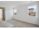 Light-filled bedroom with large windows and carpet flooring at 1281 Rock Cliff Ave, Erie, CO 80516