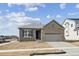 Charming single-Gathering home features a brick facade, gray siding, and attached two-car garage at 1281 Rock Cliff Ave, Erie, CO 80516