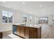 Bright kitchen featuring a central island and open floor plan at 1281 Rock Cliff Ave, Erie, CO 80516