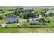 Spacious property featuring outbuildings, mature trees, and a large fenced yard at 1550 Ajax St, Strasburg, CO 80136