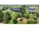 Expansive property with well-maintained landscaping, mature trees and detached garage at 1550 Ajax St, Strasburg, CO 80136