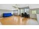 Bonus room has great natural lighting with hardwood floors, and space for relaxing at 1550 Ajax St, Strasburg, CO 80136