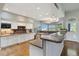 Gourmet kitchen with granite countertops, stainless steel appliances, and ample cabinet space at 1550 Ajax St, Strasburg, CO 80136