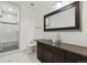 Bright bathroom features granite countertop, modern sink, and glass shower at 12939 Wabash Ct, Thornton, CO 80602