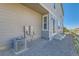 Backyard view of home with gravel, air conditioning unit, and view of walking path at 2419 Flats St, Erie, CO 80516