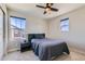 Cozy bedroom featuring a comfortable bed, and large windows providing plenty of natural light at 2419 Flats St, Erie, CO 80516