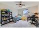 Colorful bedroom with a playful decor, bookshelf, desk and ample room at 2419 Flats St, Erie, CO 80516