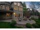 A patio area with comfortable seating arrangements and a fire pit, perfect for outdoor gatherings in the backyard at 5320 S Geneva St, Englewood, CO 80111