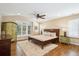 Comfortable bedroom with hardwood floors, a ceiling fan, and natural light at 5320 S Geneva St, Englewood, CO 80111